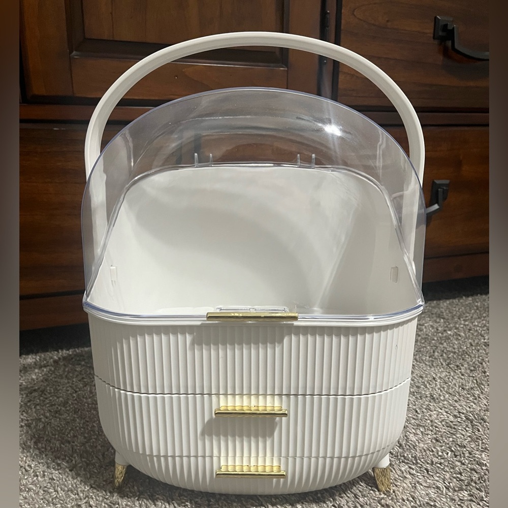 Makeup organizer white with gold accents. Has 2 drawers and handle
